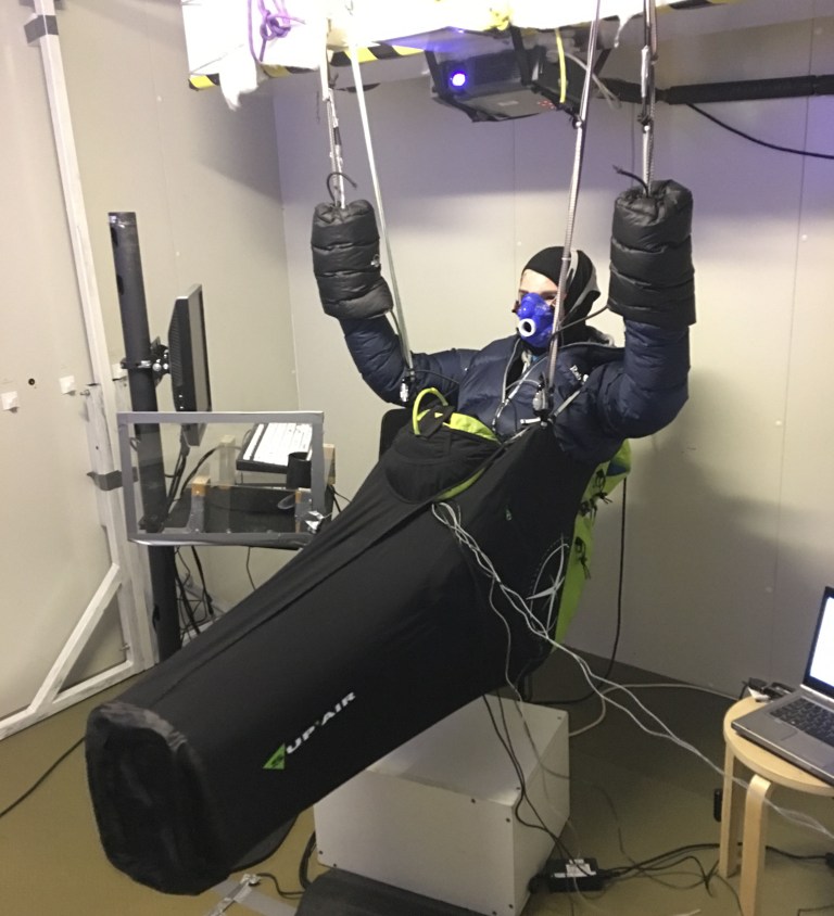 A pilot flying in the paragliding flight environment simulator